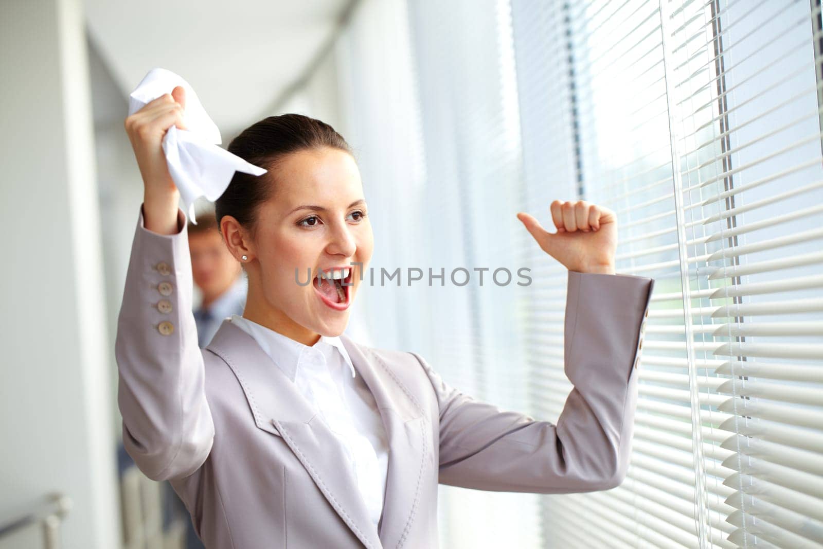 Portrait of joyful businesswoman shouting