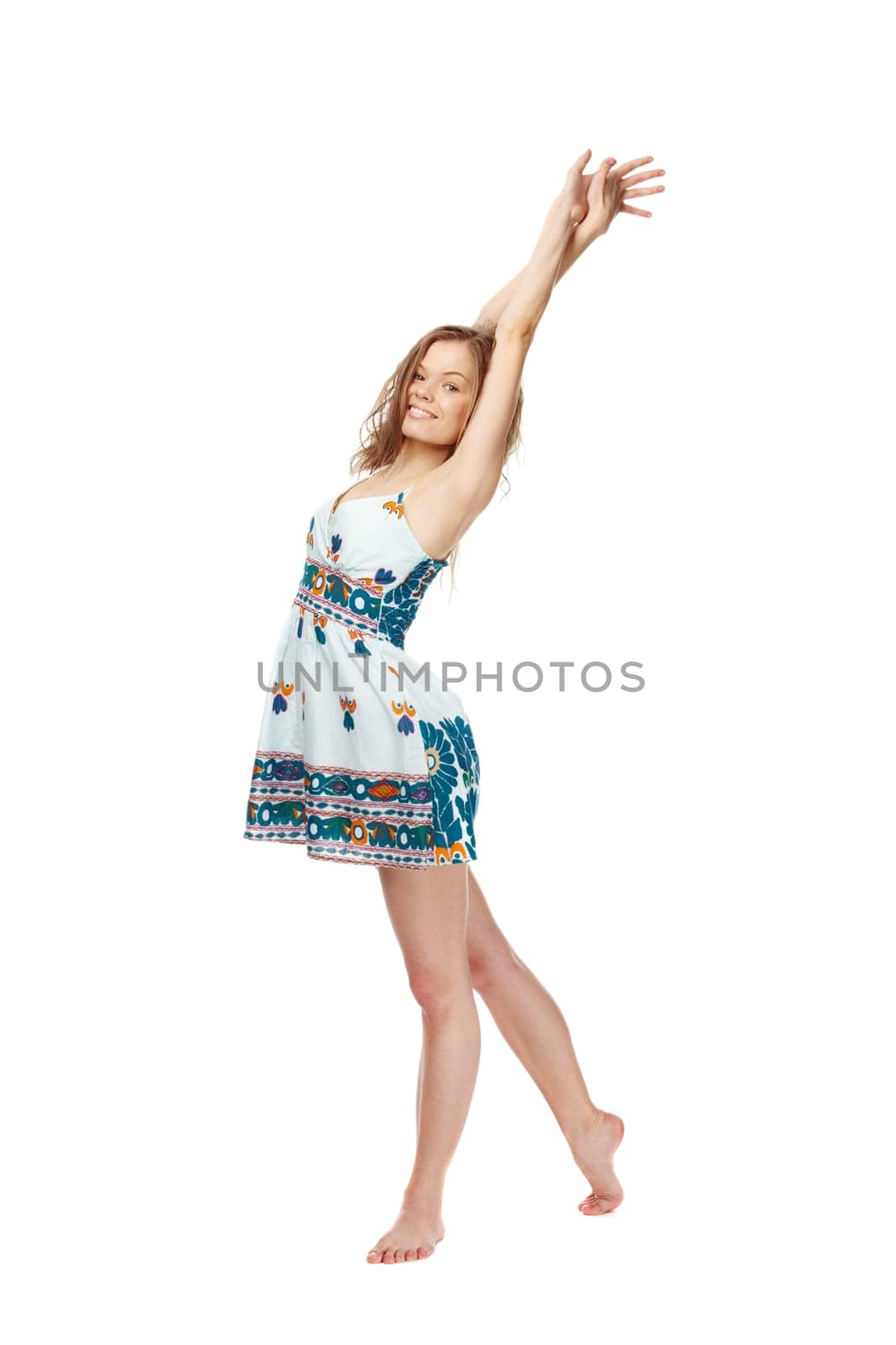 Portrait of a young girl in sundress stretching herself