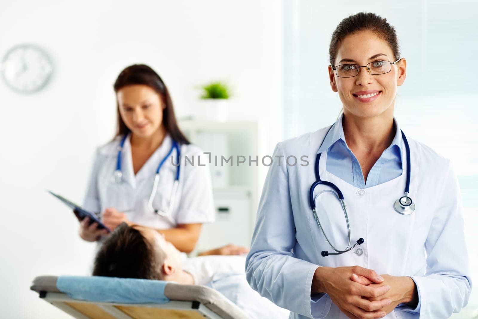 Portrait of confident female doctor looking at camera in hospital