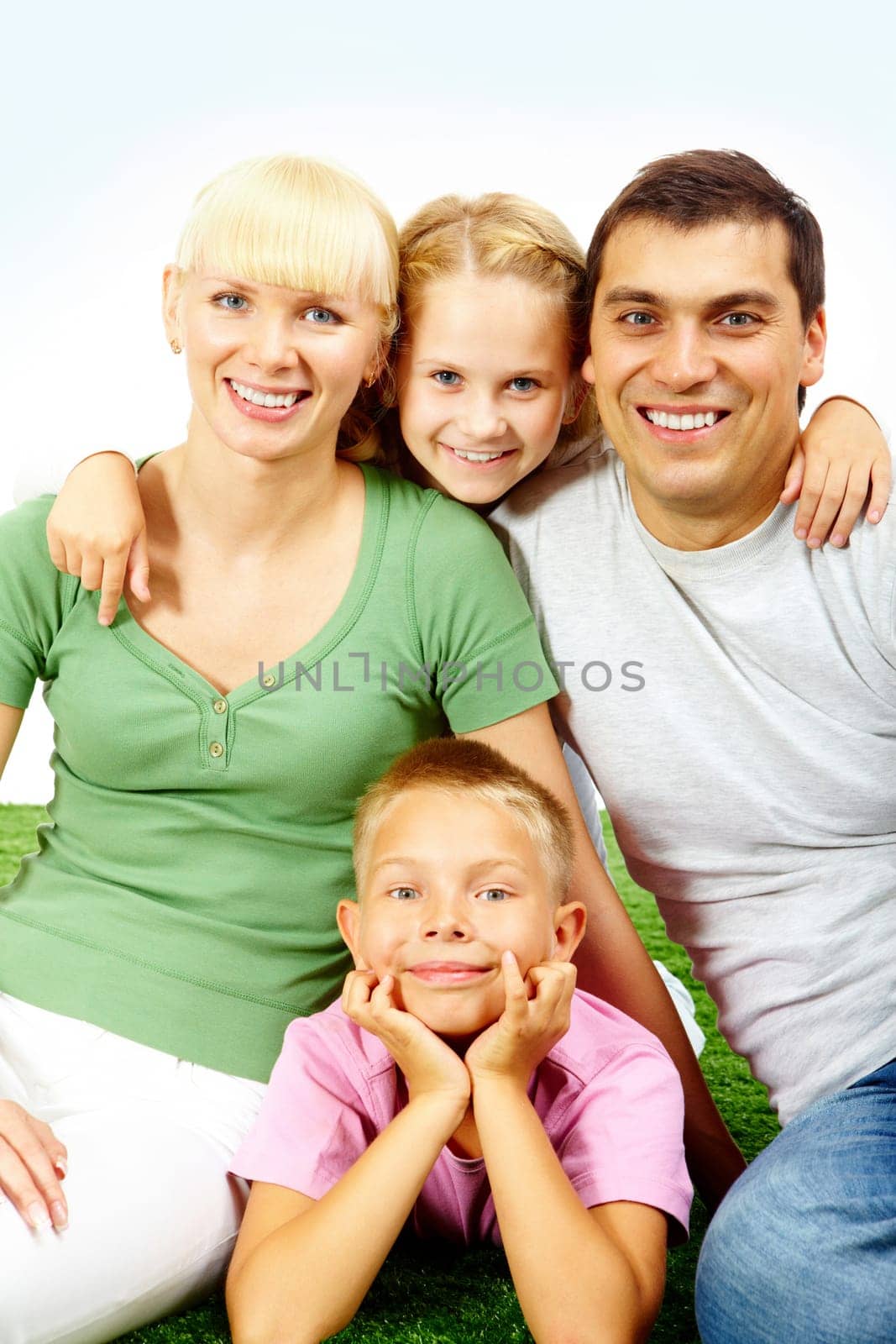 Portrait of happy family in casual clothes looking at camera