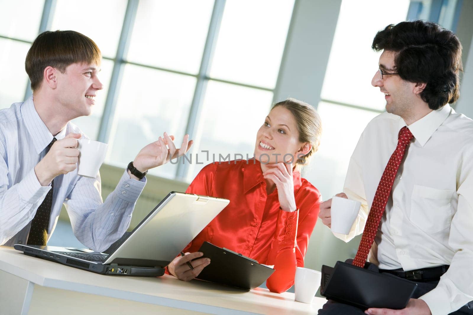 Photo of business people discussing a new idea during coffee break