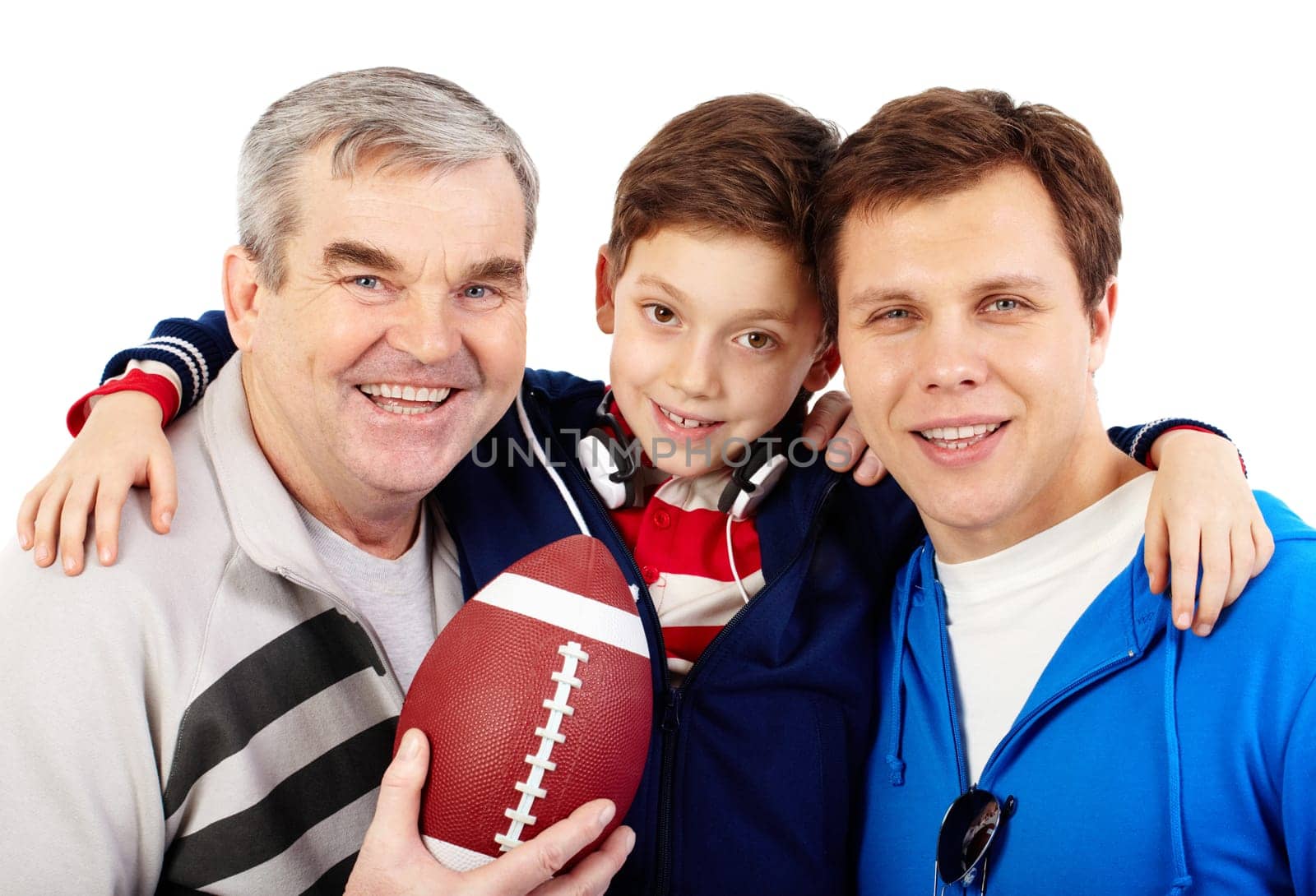 Three men with rugby ball looking at camera