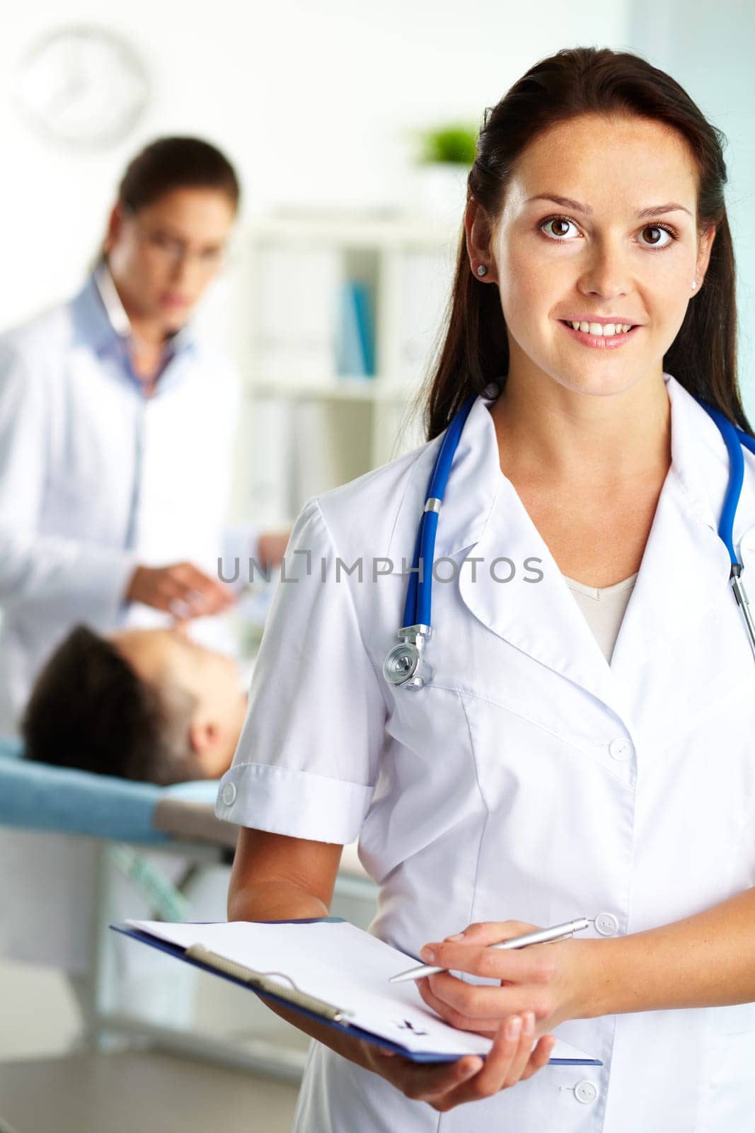 Portrait of confident female doctor looking at camera in hospital