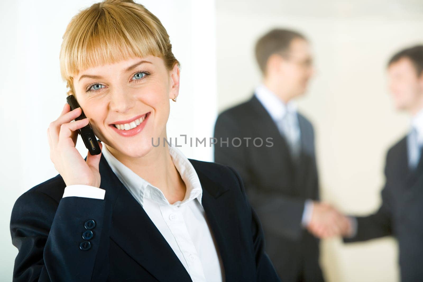 Portrait of beautiful business woman calling on the telephone