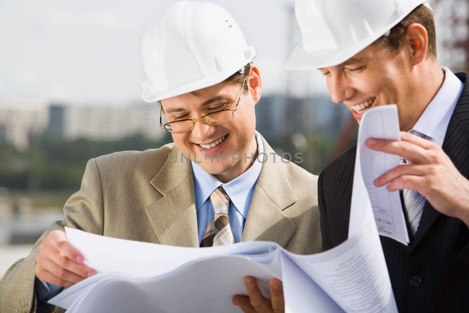 Confident architect  is proposing a new plan of building to his chief
