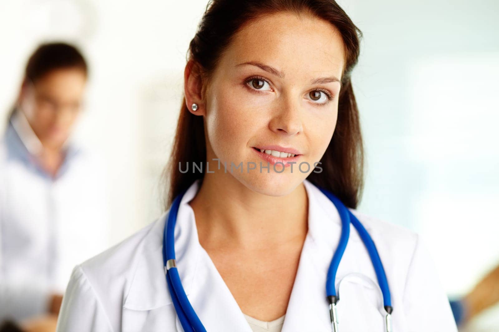 Portrait of confident female doctor looking at camera in hospital