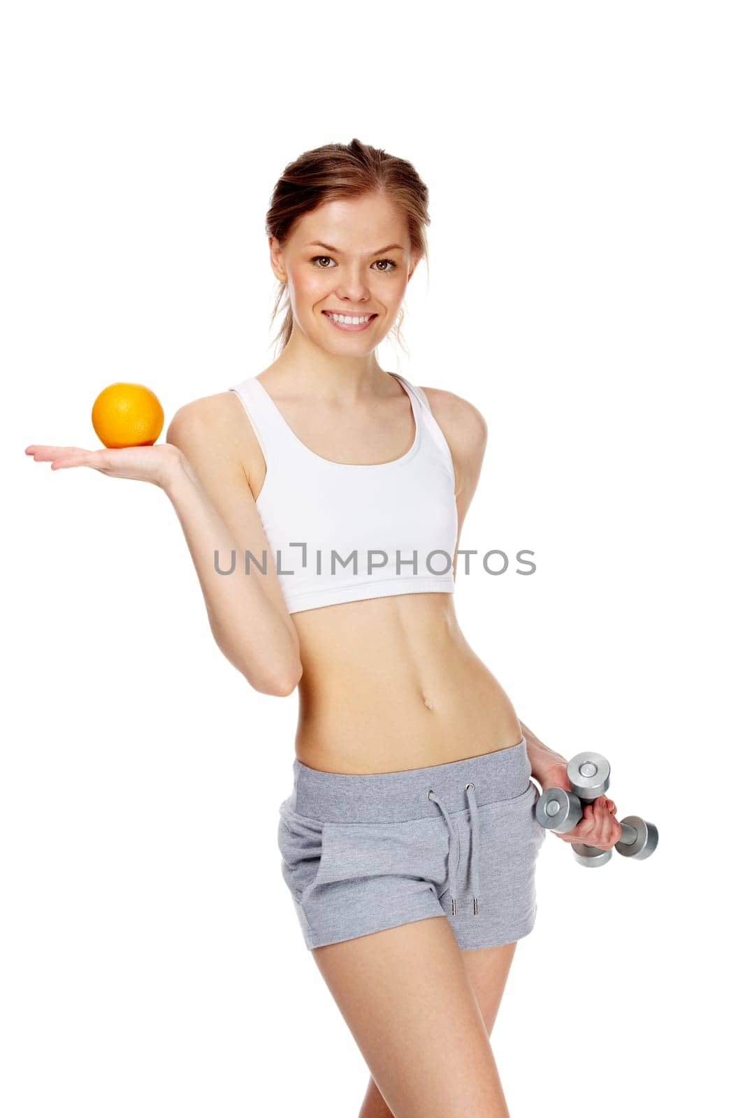 Portrait of slim young woman orange and dumbbells
