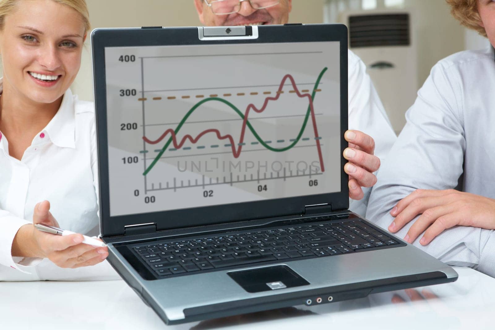 Portrait of successful business partners showing new computer project