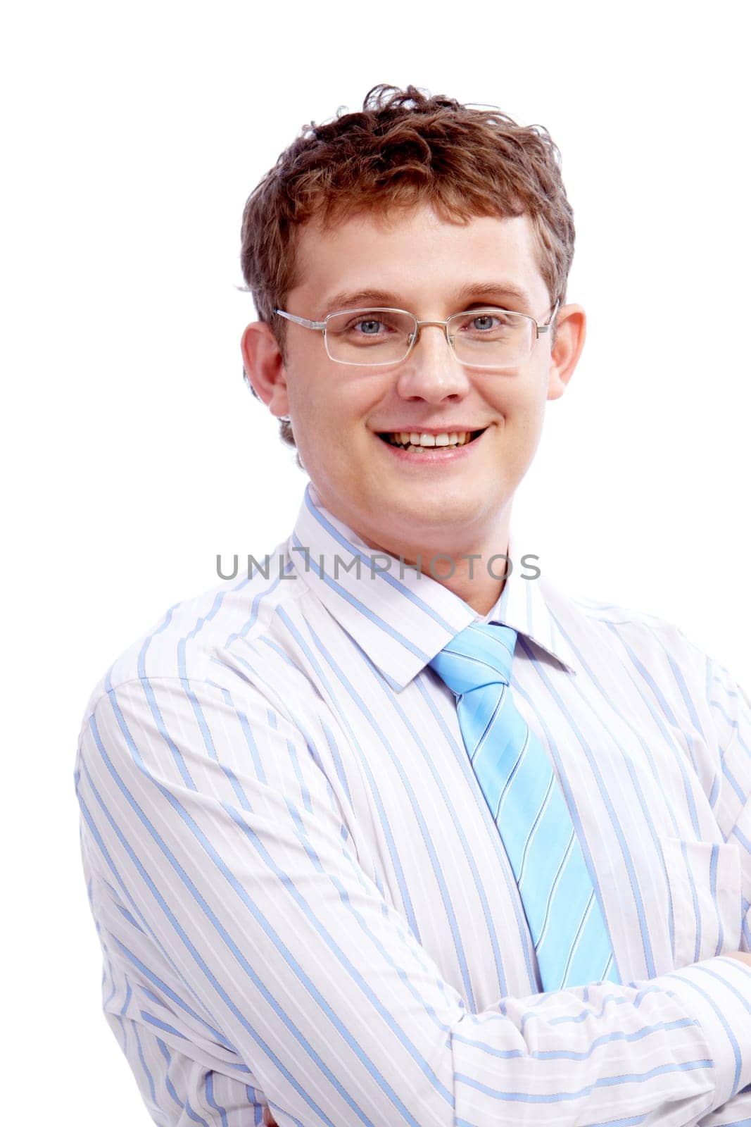 Portrait of young handsome businessman with crossed arms looking at camera