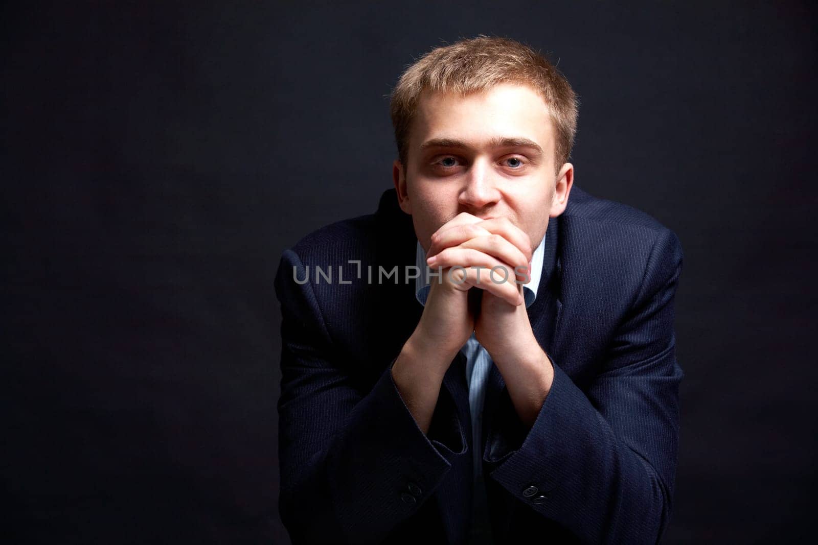Portrait of stylish businessman looking at camera