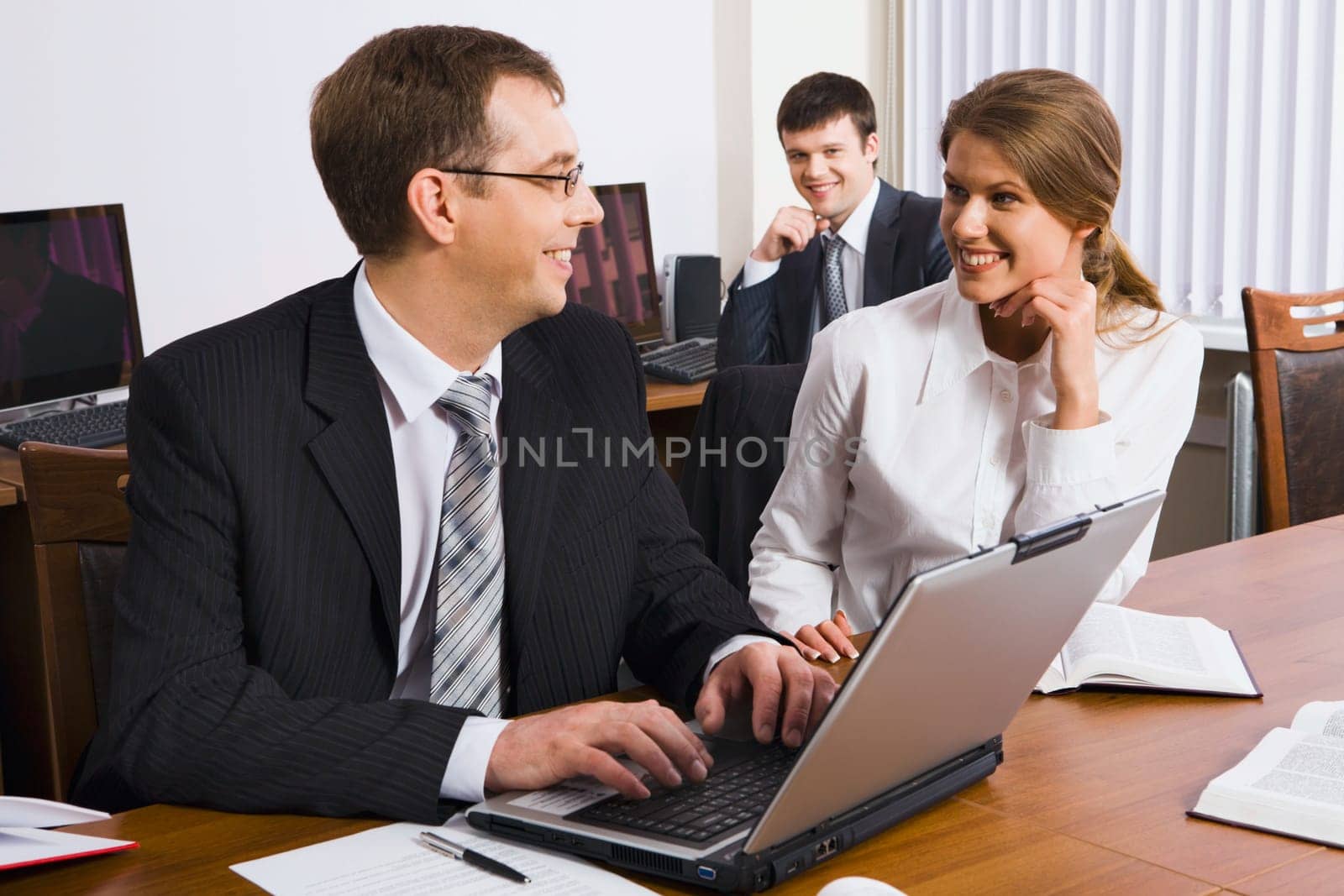 A man explains the marketing plan of work to his colleague in business environment