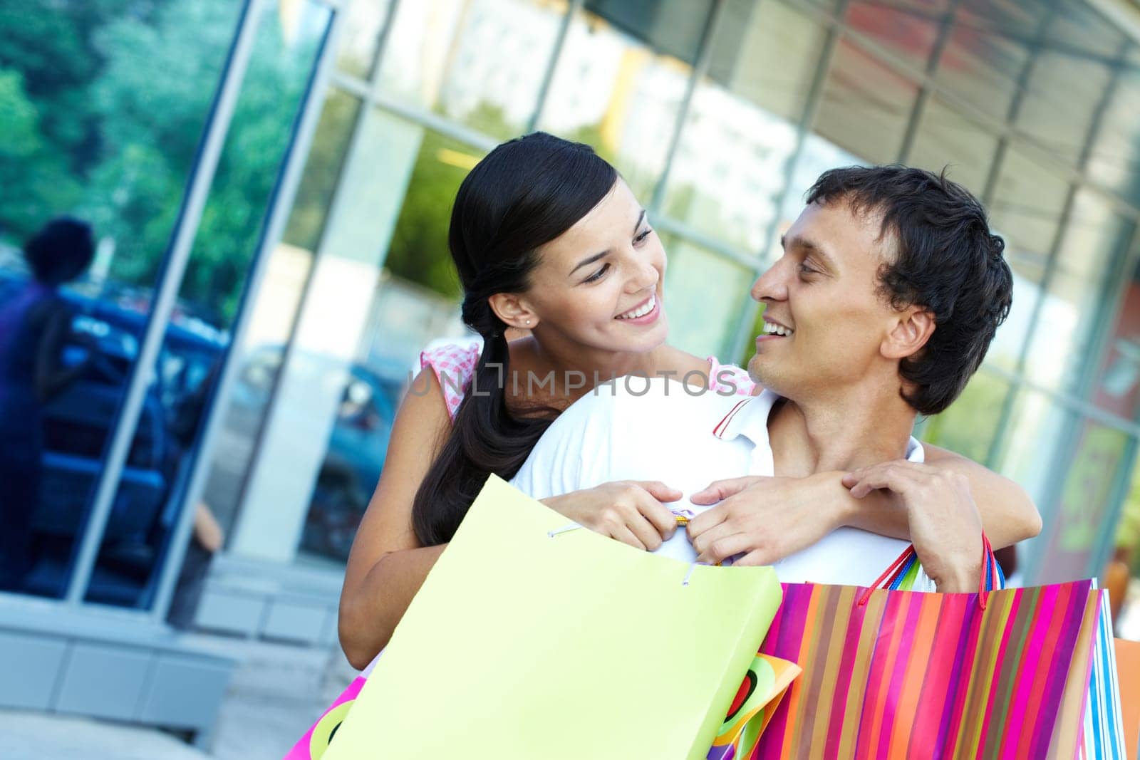 Happy couple with shopping bags
