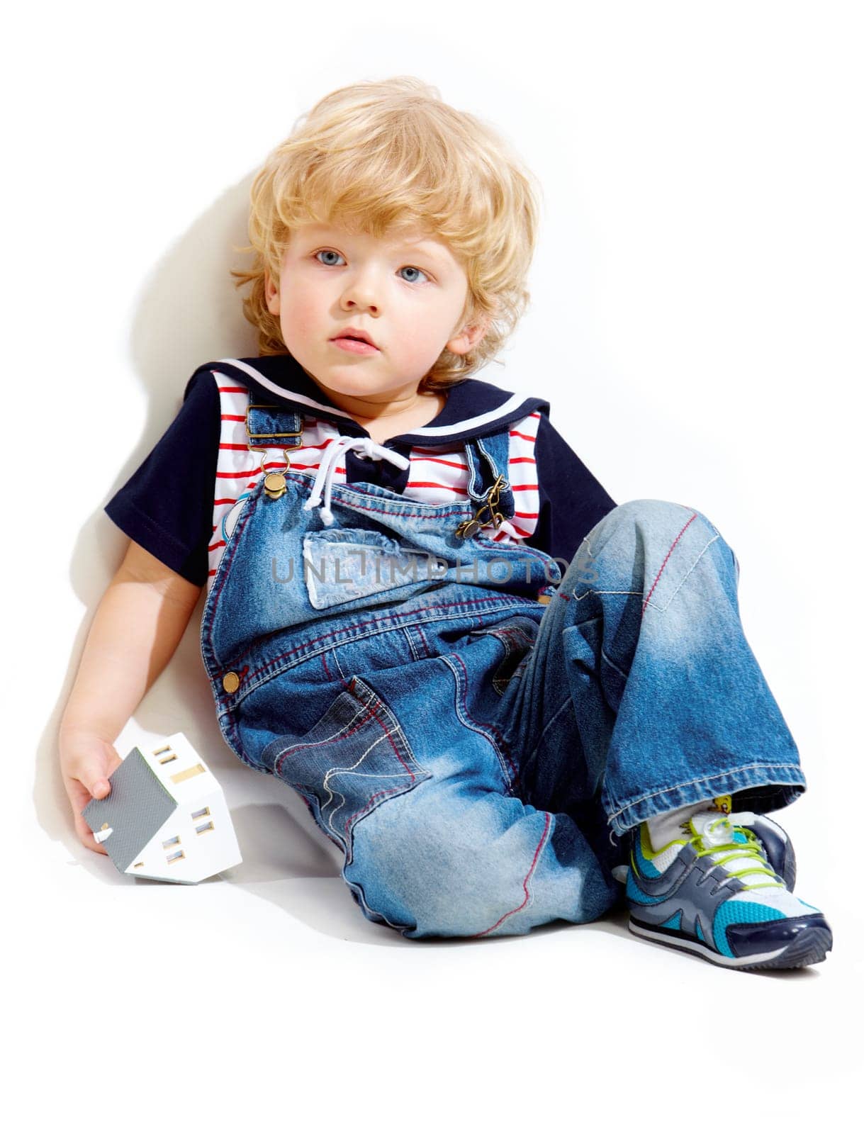 Portrait of pensive kid on white background