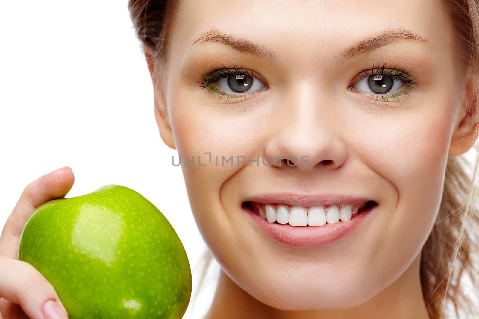 Portrait of pretty woman with smile holding green apple