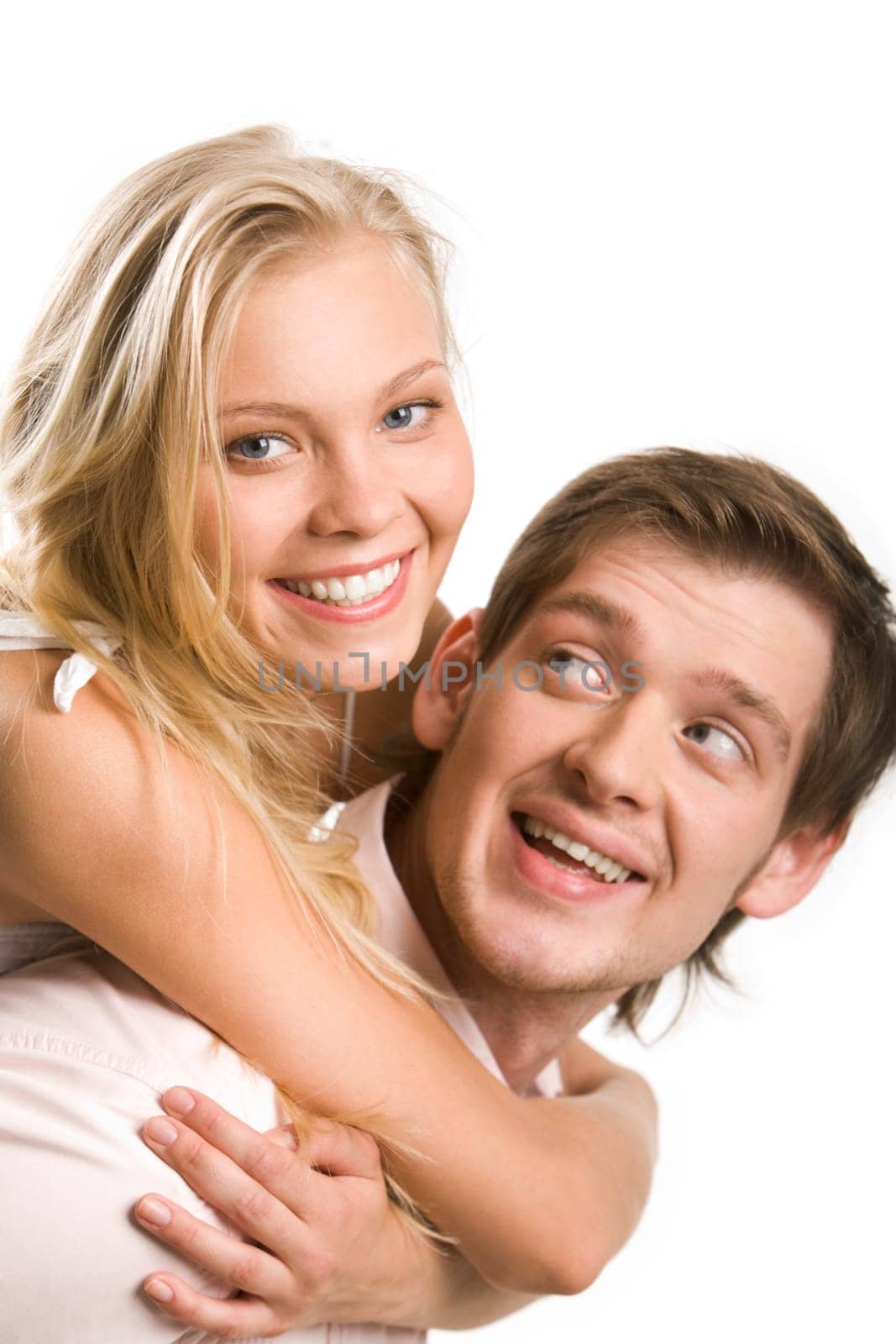 Image of pretty blonde embracing boyfriend while he looking at her with smile