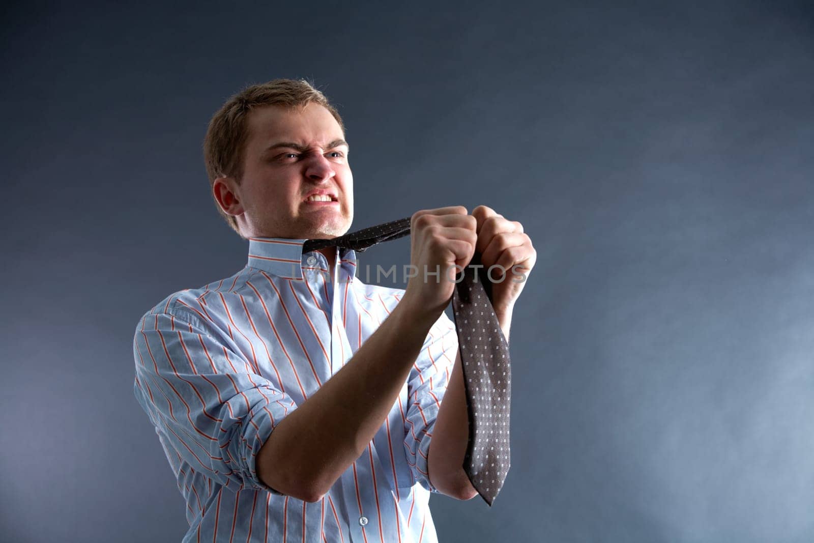 Portrait of young man in problem showing his dissatisfaction