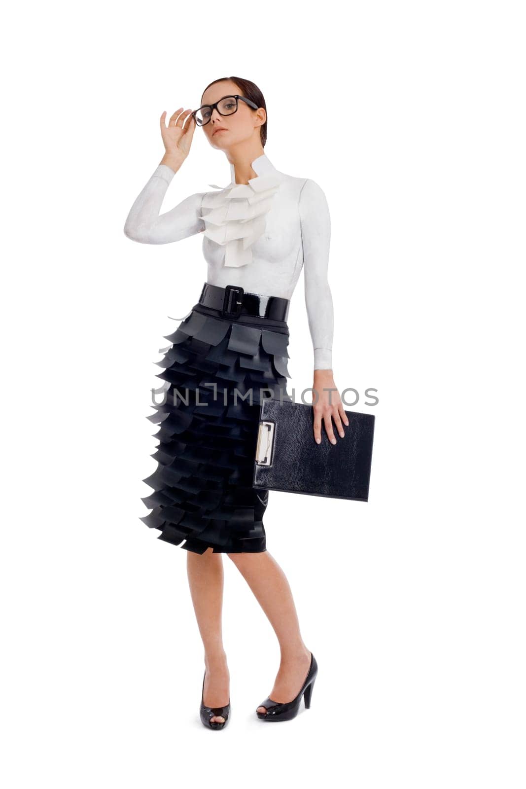 Portrait of elegant businesswoman with folder in hand posing before camera