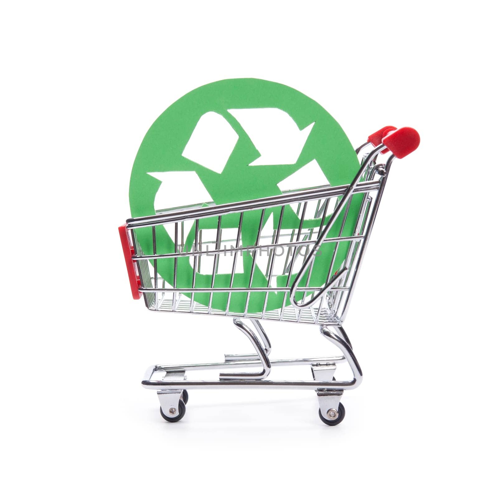 Socially responsible consumerism - buy recycled (environment-friendly) products concept. Shopping cart (shopping trolley) with green recycled symbol.