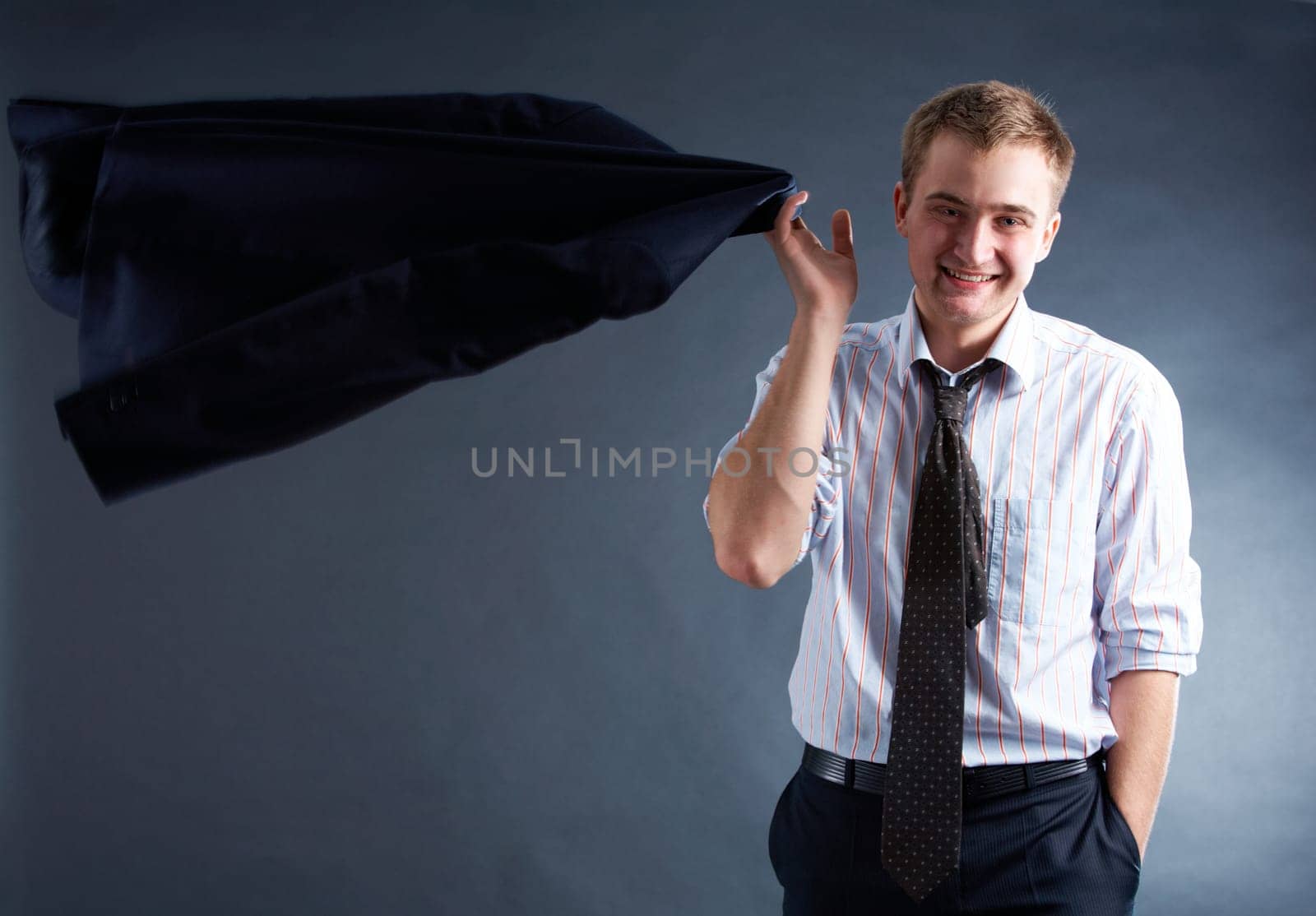 Portrait of stylish businessman with jacket looking at camera
