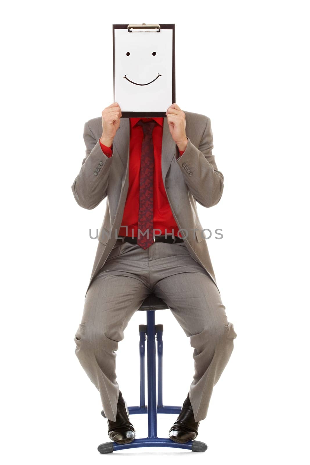 Portrait of businessman holding document with smile near his face
