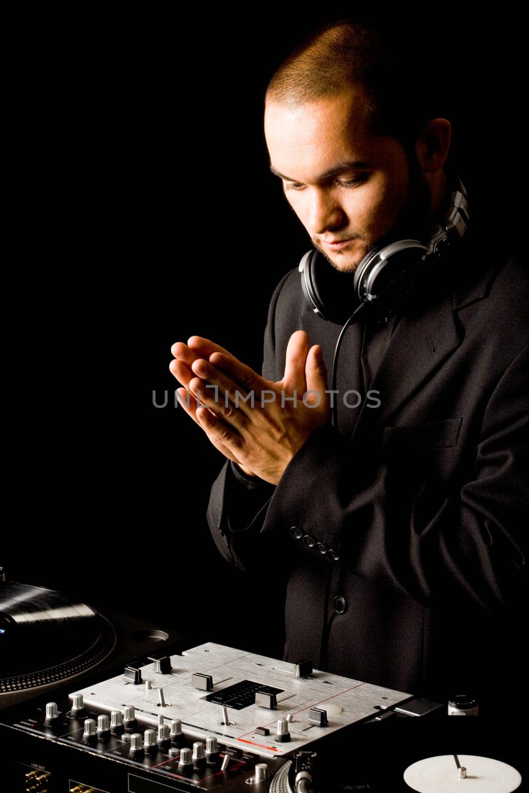 Portrait of handsome deejay at work