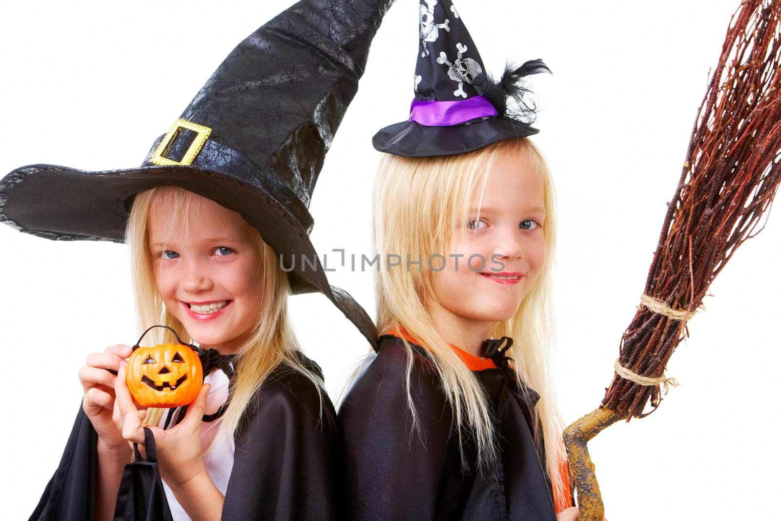Portrait of twin girls in black hats and black clothing