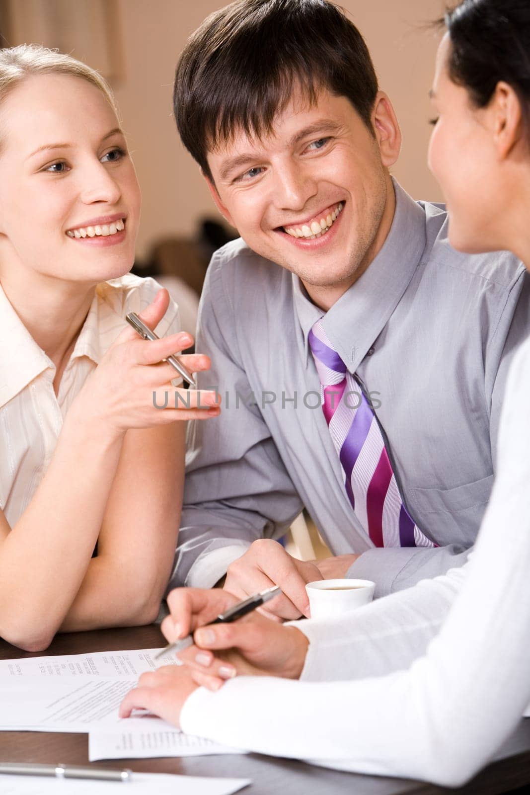 Portrait of successful business people considering a new project and smiling