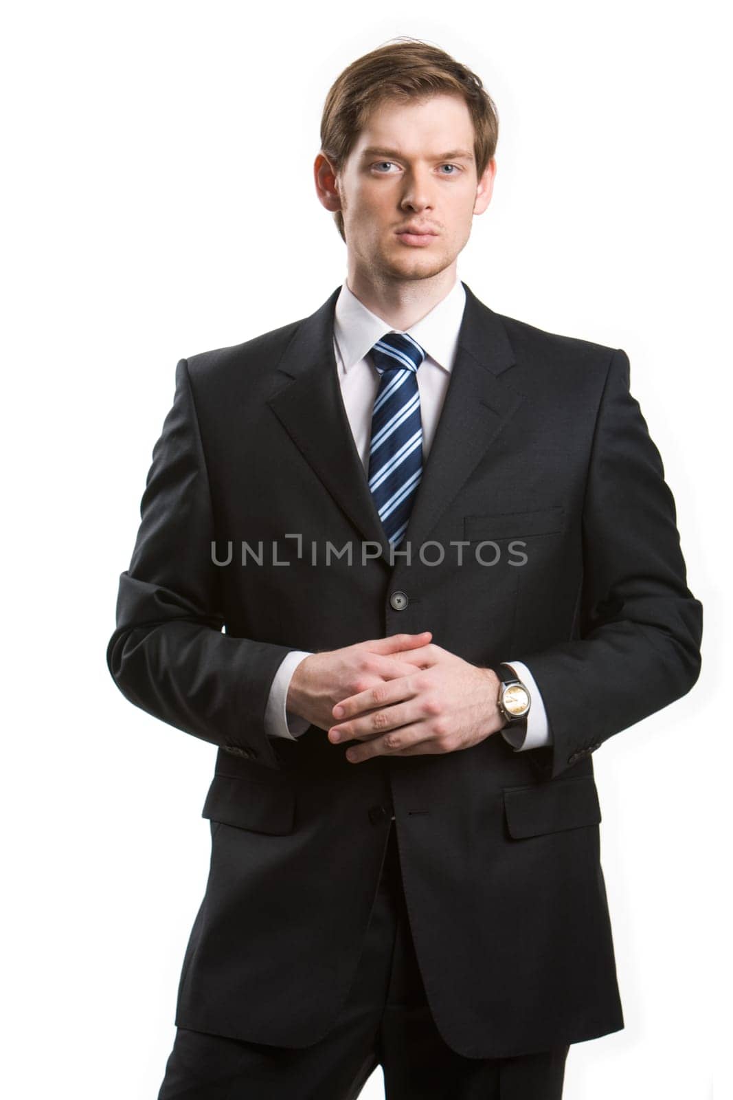 Portrait of young handsome businessman looking at camera on white background