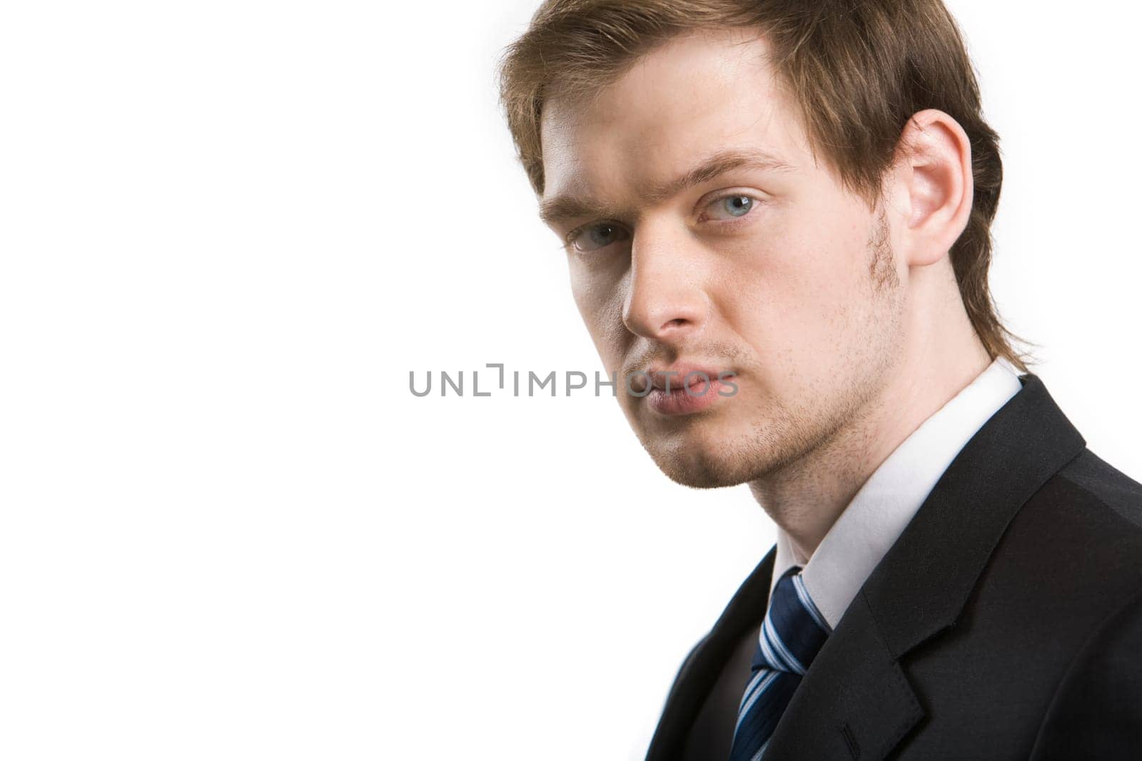 Smart serious businessman looking at camera on white background
