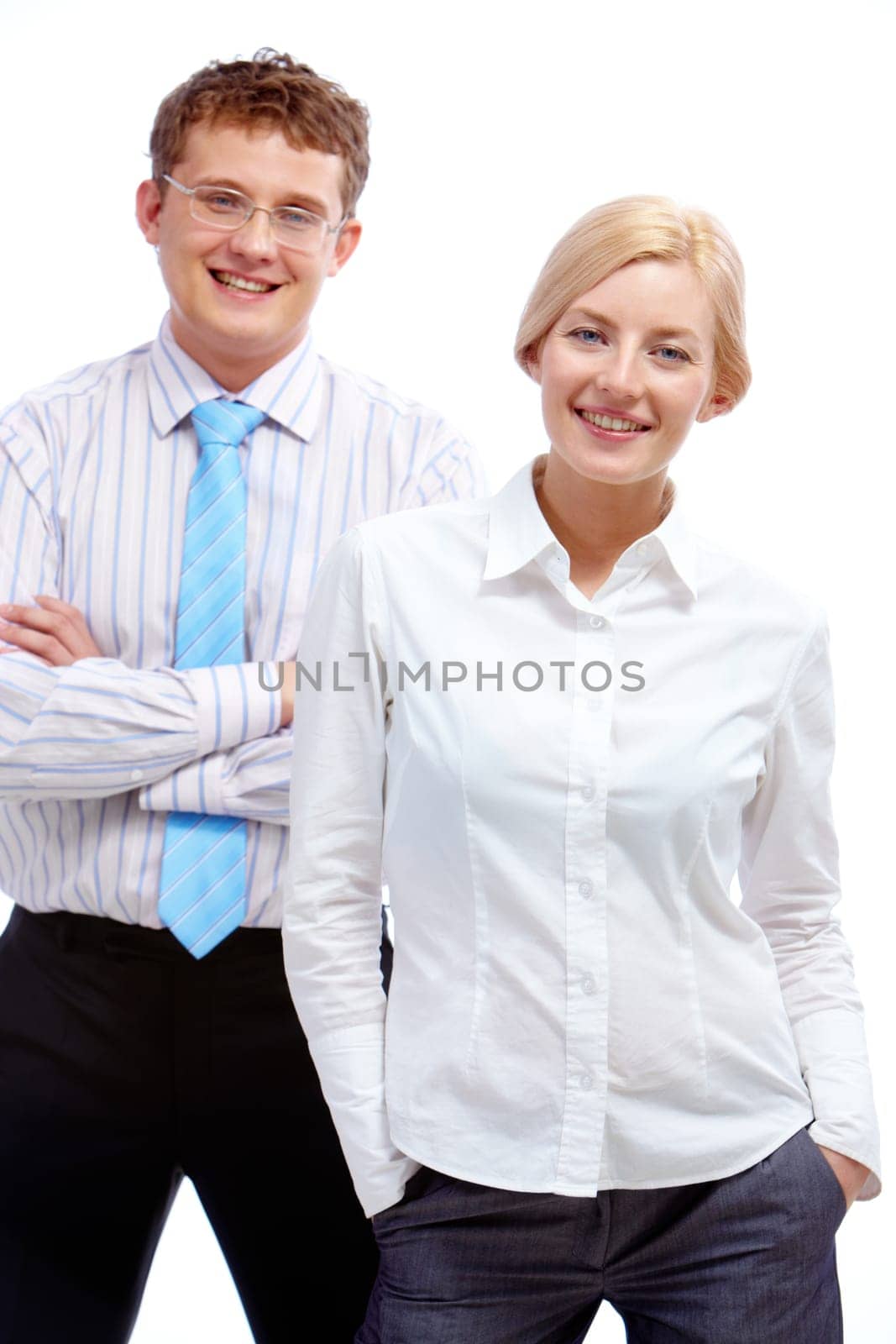 Portrait of successful businesswoman looking at camera with happy partner behind her