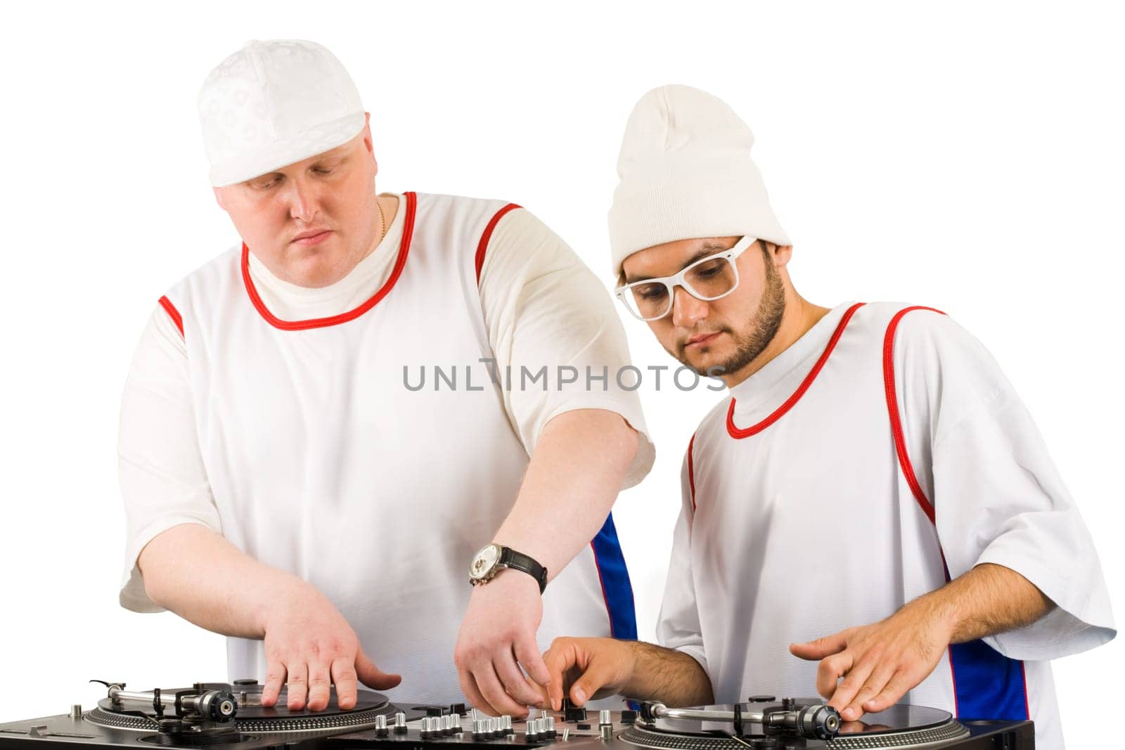 Portrait of two smart deejays at work spinning turntables