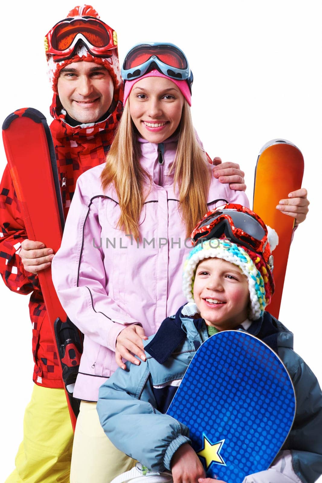 Portrait of happy family with snowboards looking at camera on white background