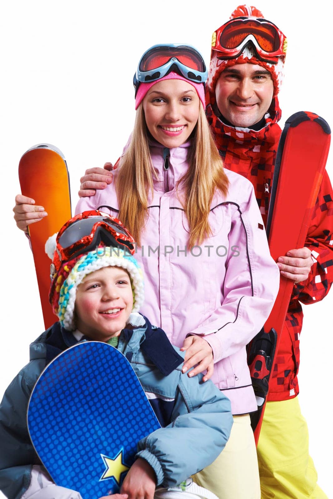 Portrait of happy family with snowboards looking at camera on white background