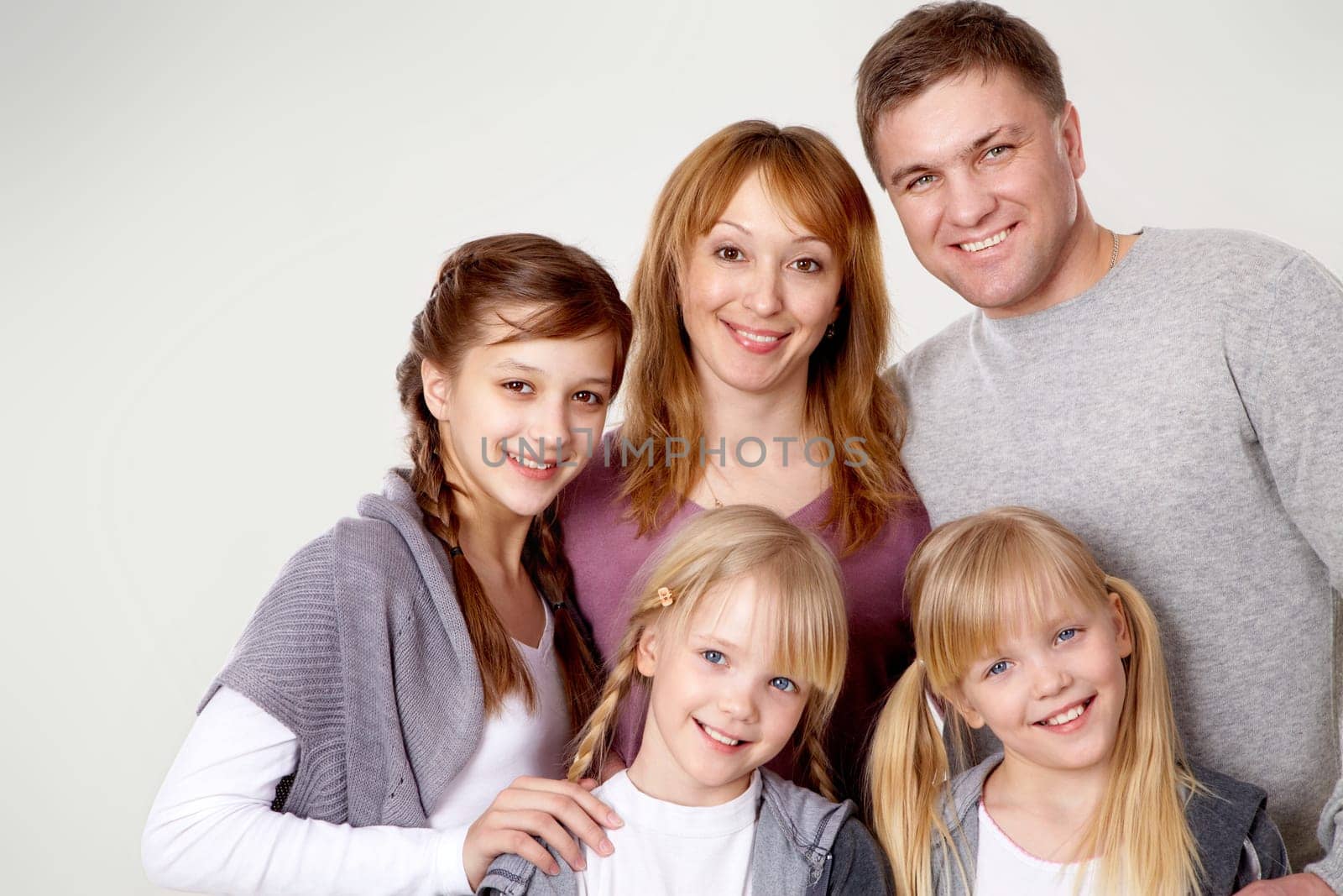 A young friendly family looking at camera