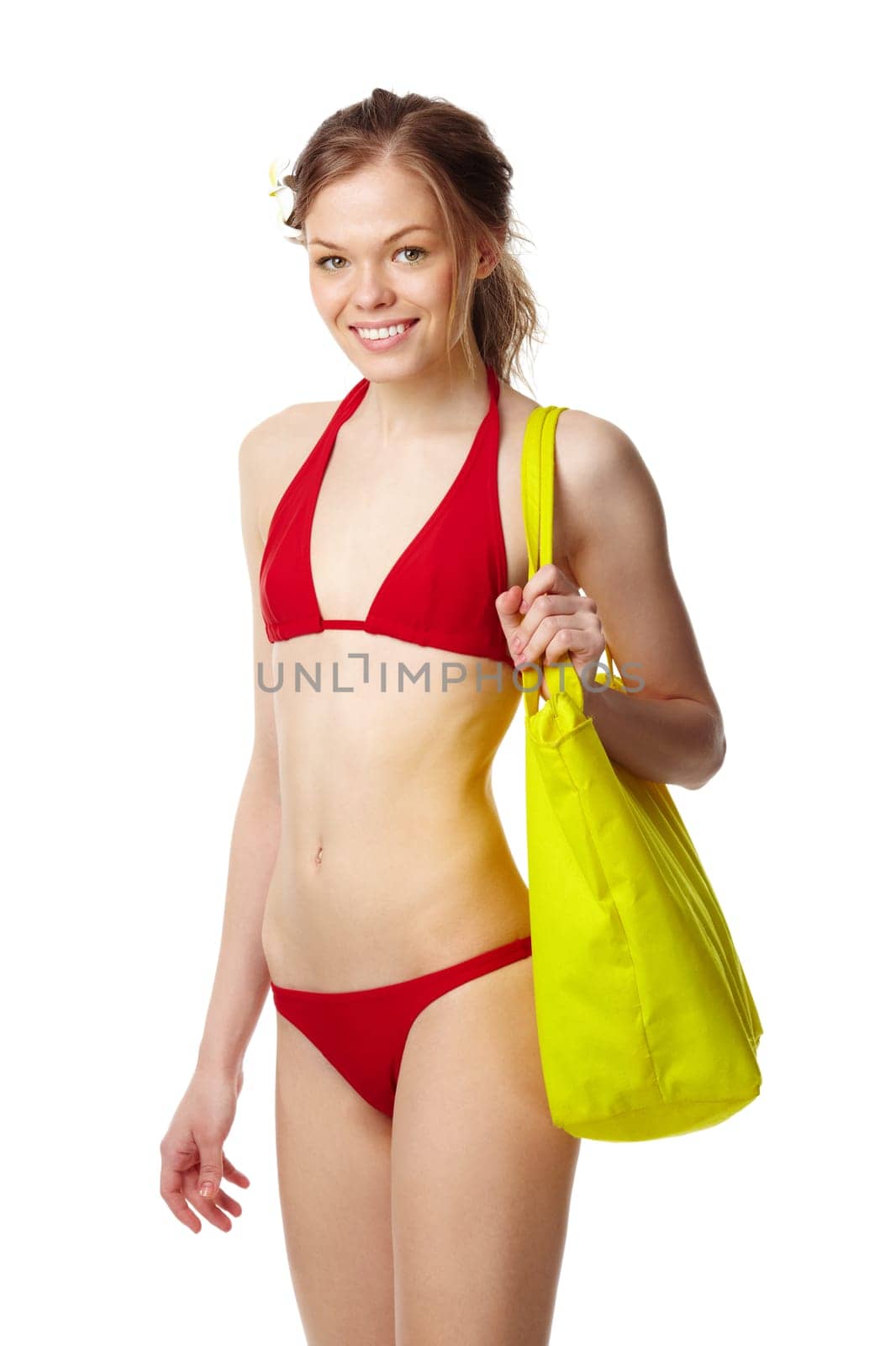Portrait of a young girl in red bikini looking at camera and smiling