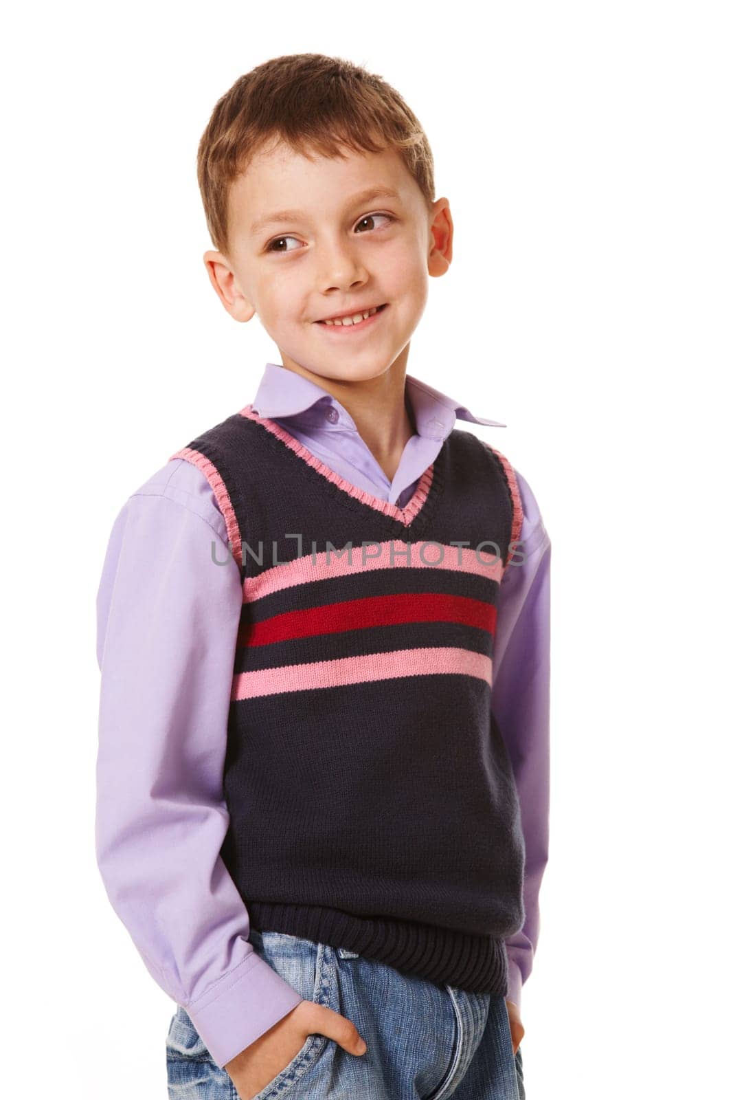 Portrait of smiling boy looking aside on a white background