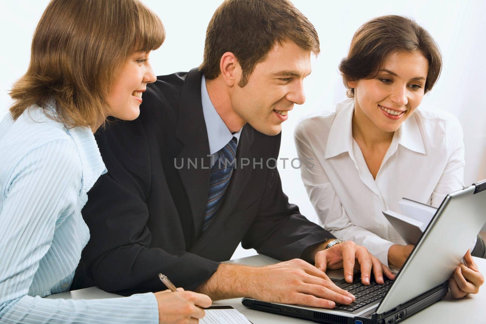 Business team discuss business ideas in front of the computer