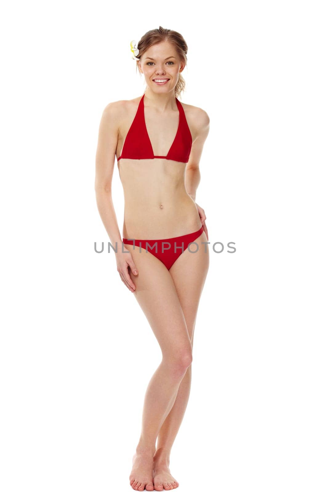 Portrait of a young girl in red bikini isolated on white