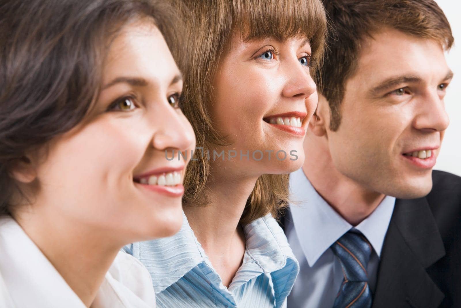 Portrait of three young smiling businesspeople
