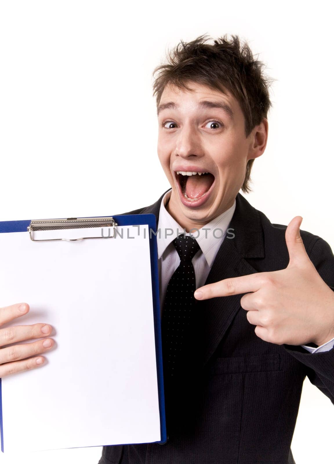 Photo of surprised businessman pointing at blank paper in his hand