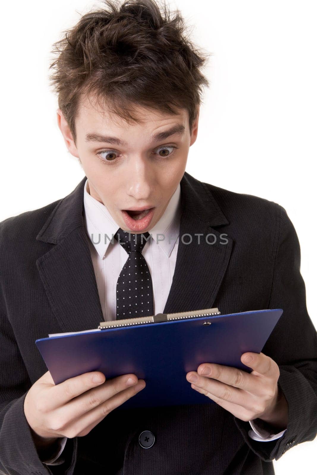Image of shocked businessman looking at document surprisingly with open mouth