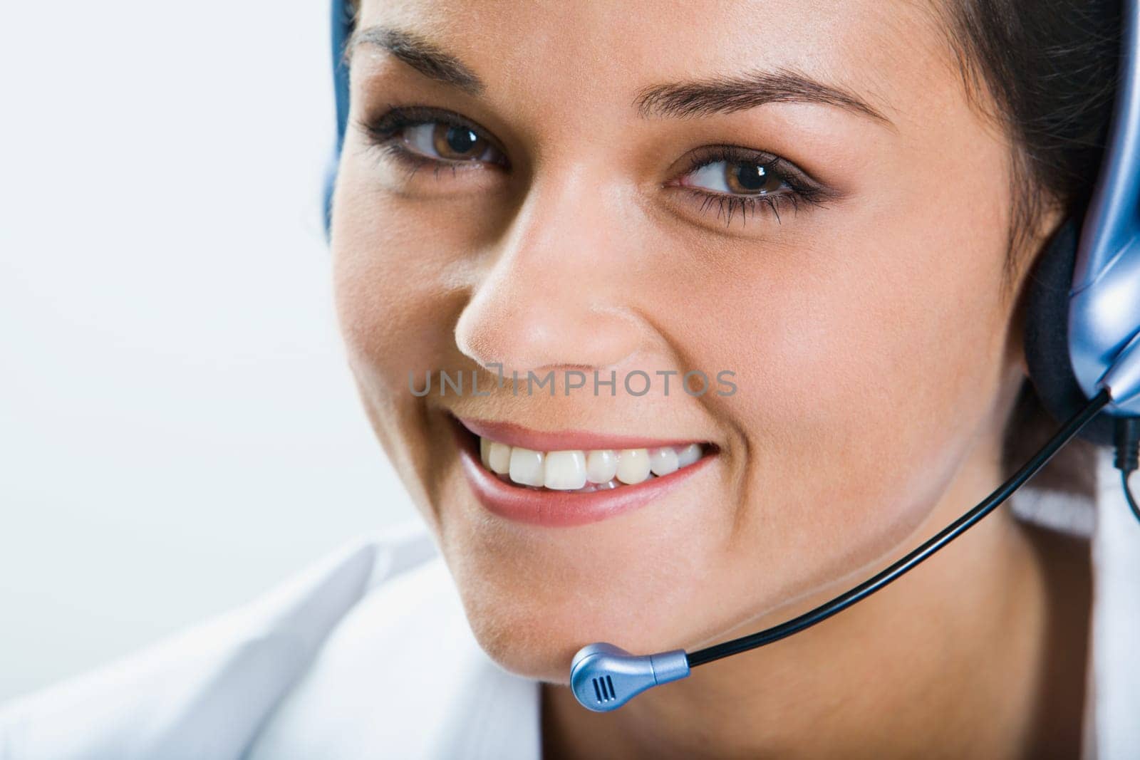 Portrait of  beautiful smiling telephone operator with headset