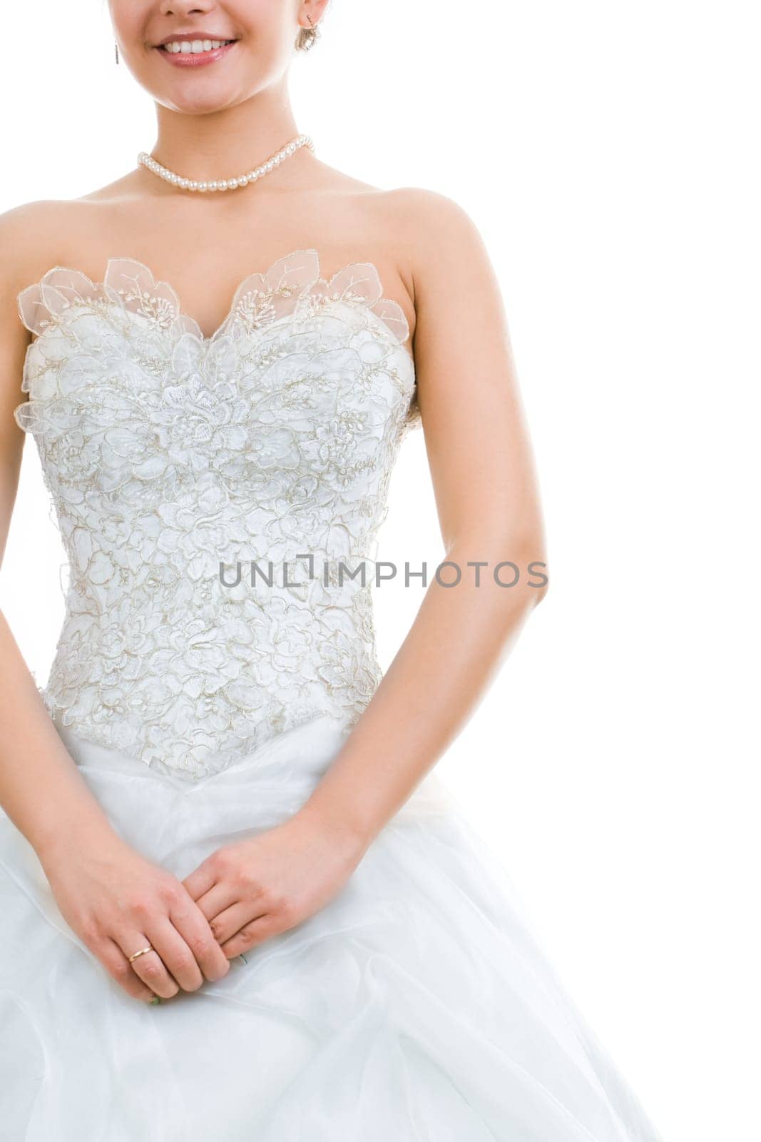 Photo of pretty bride in wedding dress isolated on a white background