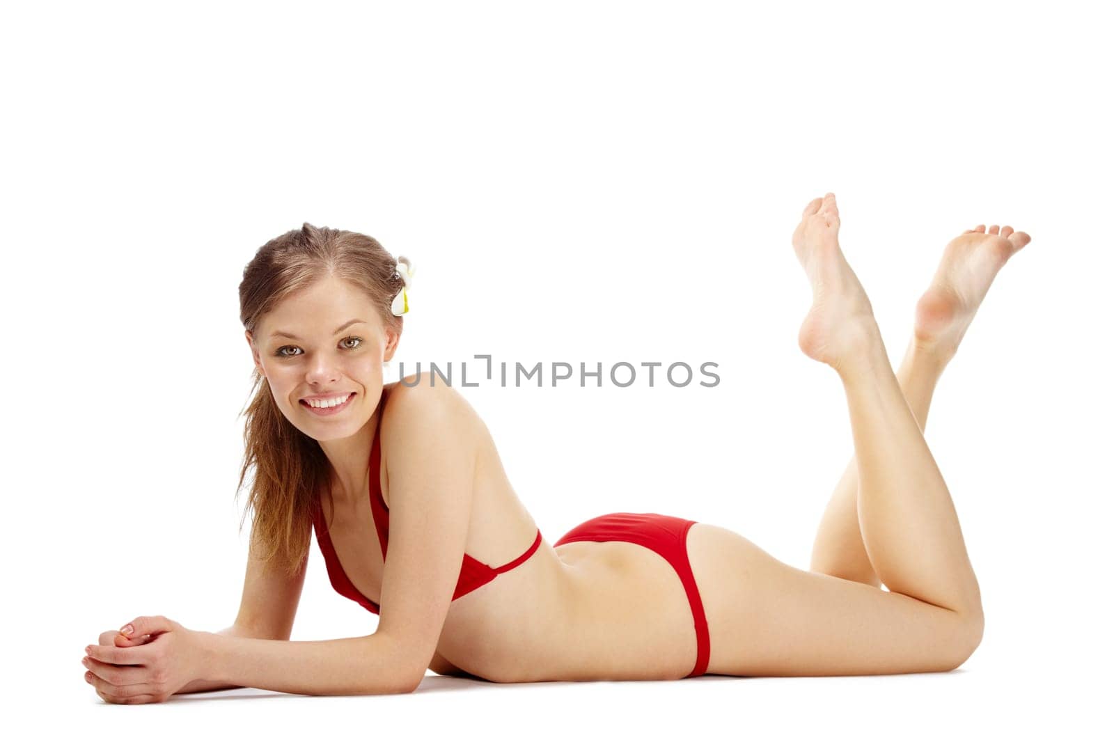 Portrait of a young happy girl in red bikini