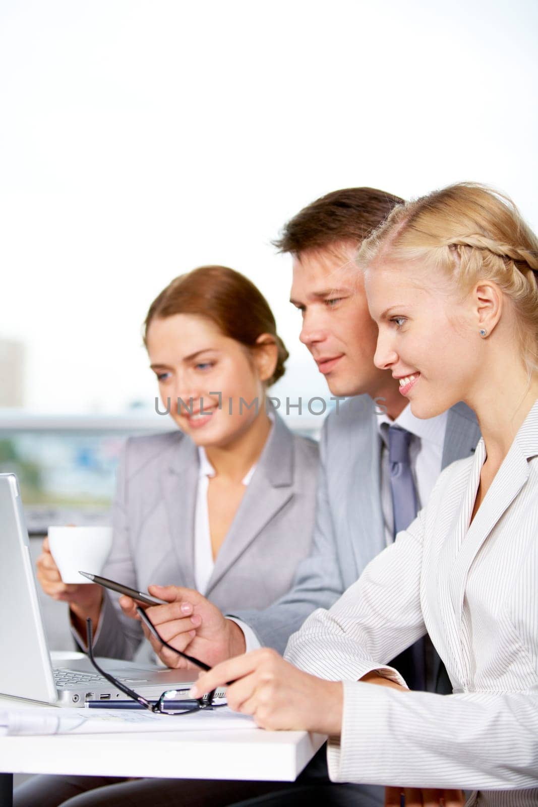 Image of successful businesspeople discussing new project or plan at meeting