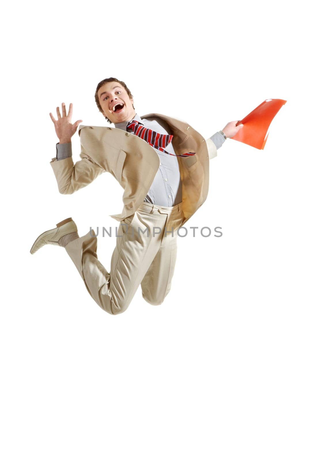 Portrait of cheerful businessman jumping with folder in hands