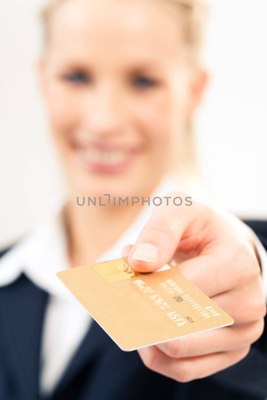 Close-up of plastic credit card in businesswomans hand