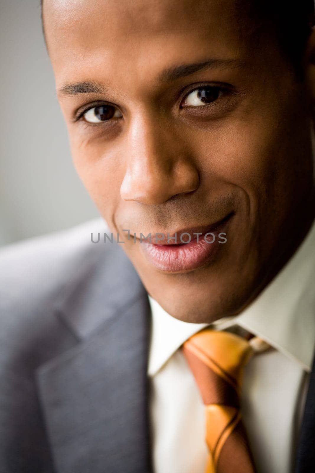 Portrait of successful white collar worker looking at camera and smiling