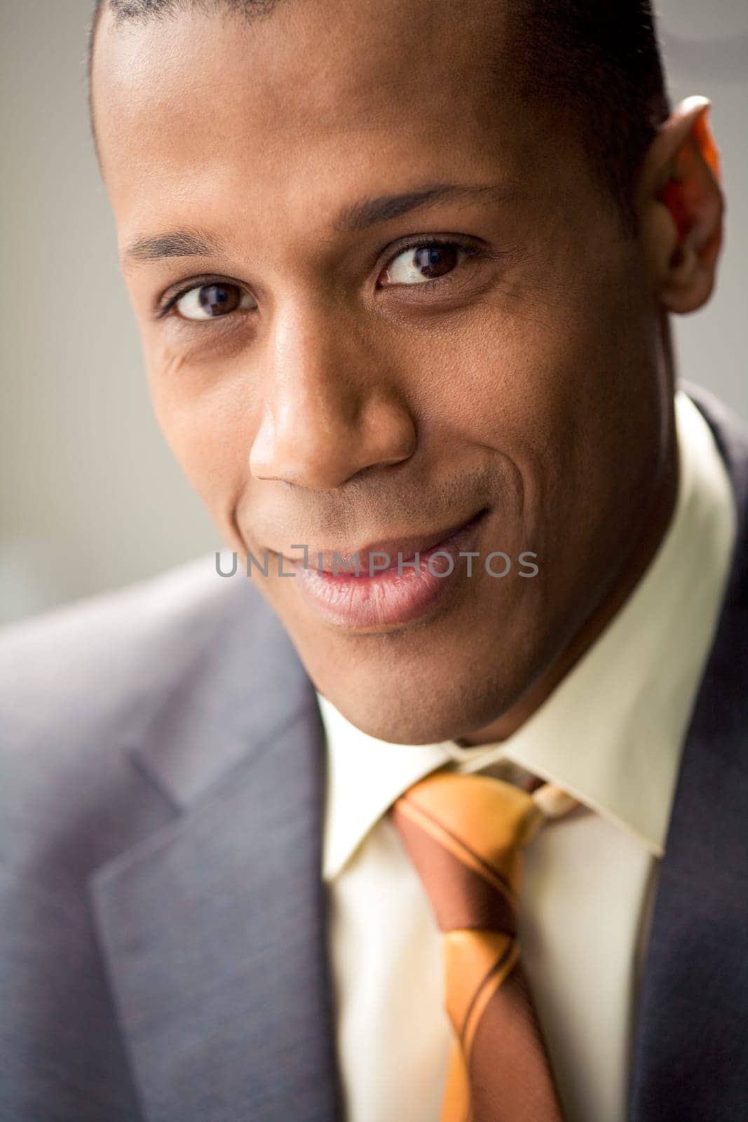 Portrait of successful white collar worker looking at camera and smiling