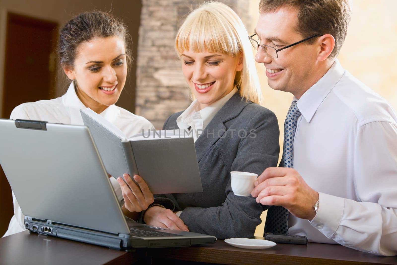 Confident business people are working together at meeting